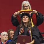 Dana Gentry Eicher with her faculty advisor, Dr. Amy Lee, at the doctoral hooding ceremony during the University of Alabama commencement at Coleman Coliseum
