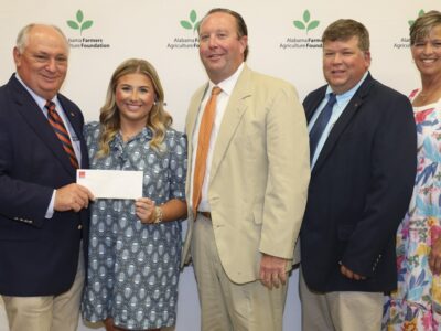 Laura Kyser, second from left, receives the John C. Jay Jr. Memorial Scholarship Sept. 21 at Lazenby Farms in Auburn. From left are Federation President Jimmy Parnell, Kyser, Hale County Farmers Federation board member Townsend Kyser, Federation District 8 Director Stewart Koon and Federation Southwest Area Vice President Hope Cassebaum.